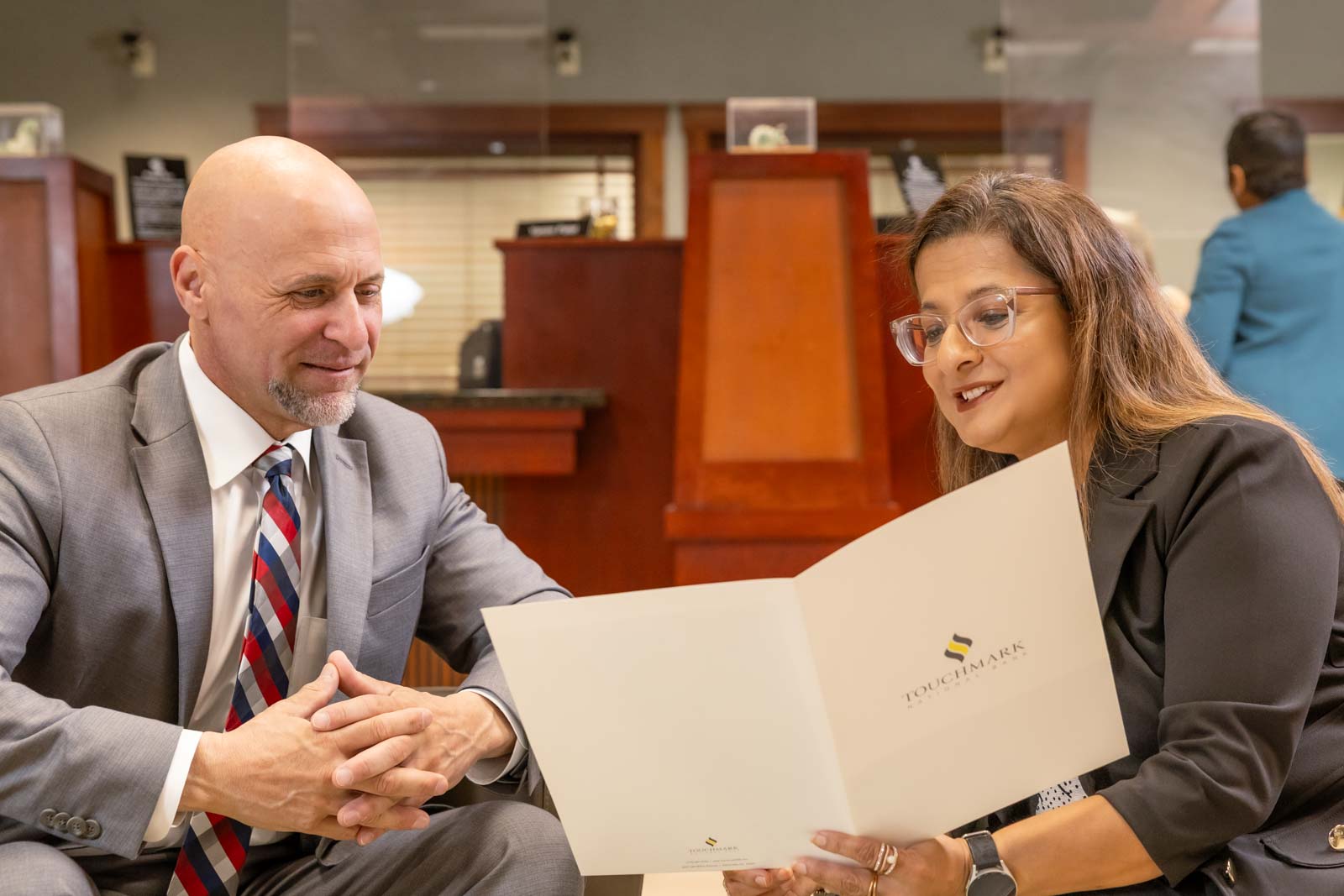 Touchmark National Bank team assisting a customer